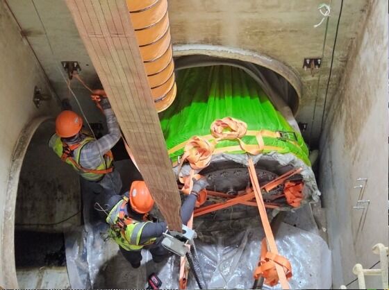 Engineers installing UV-cured glass-fibre liners