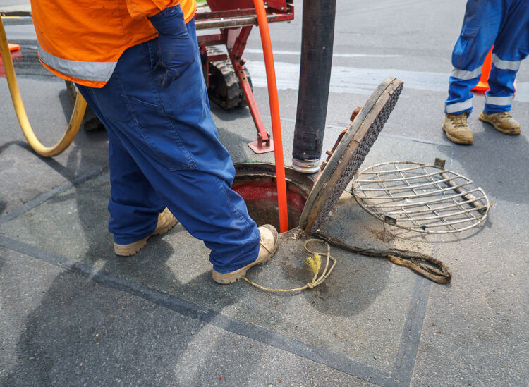 Engineers installing UV-cured glass-fibre liners